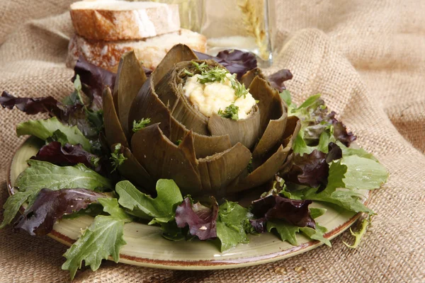 Steamed Artichoke stuffed with Hollandaise sauce — Stock Photo, Image