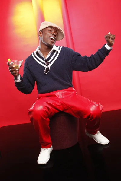 Young african american man with cocktail — Stock Photo, Image