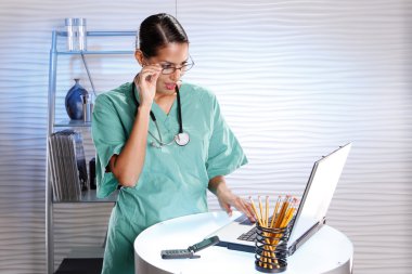 Urologist keeps records with a laptop