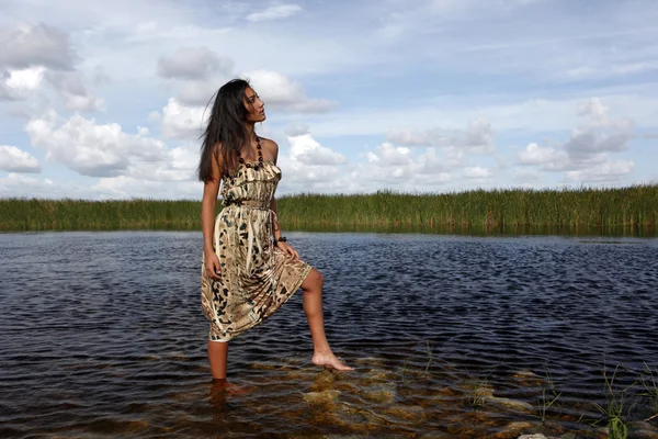 Girl standing in water — Stock Photo, Image