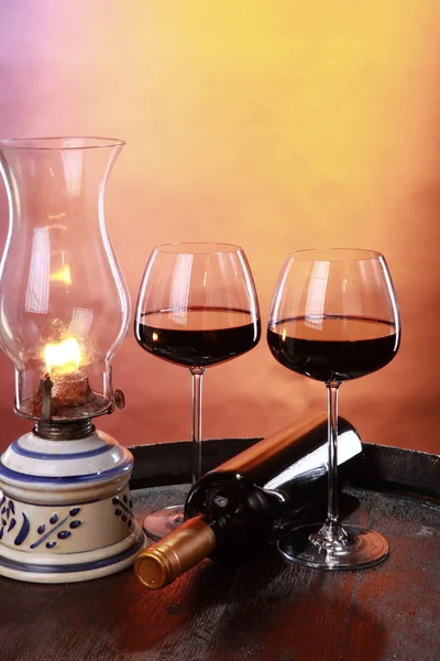 Wine glasses with bottle and lantern — Stock Photo, Image