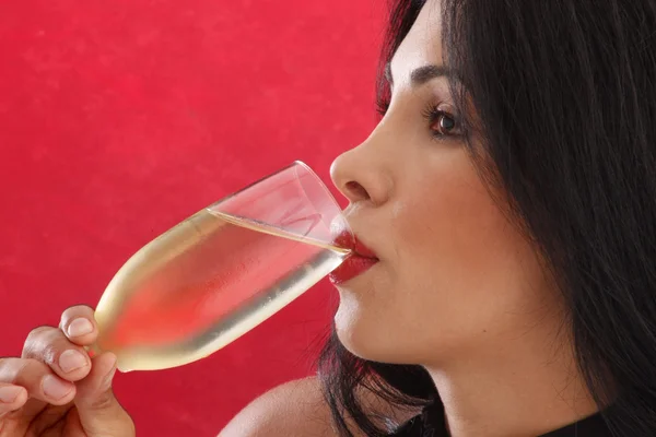 Brunette girl drinks a White wine — Stock Photo, Image