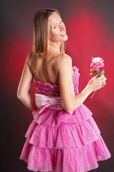 Blonde woman in pink dress — Stock Photo, Image