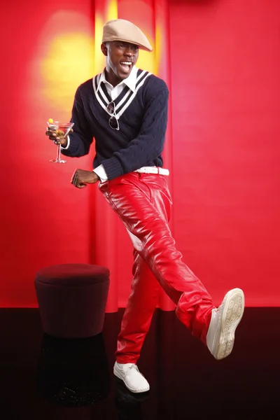 Young african american man with cocktail — Stock Photo, Image