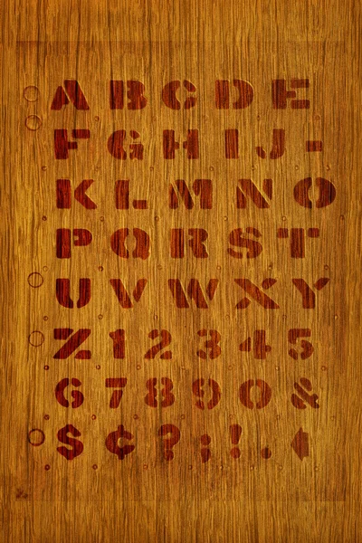 Stenciled alphabet background — 图库照片