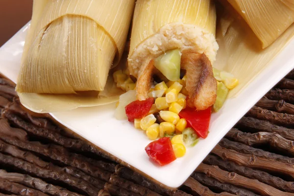 Tamale wraped in dried corn leaves — Stock Photo, Image