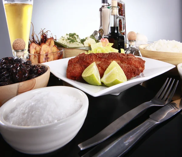 Breaded fish with staple caribbean sides — Stock Photo, Image