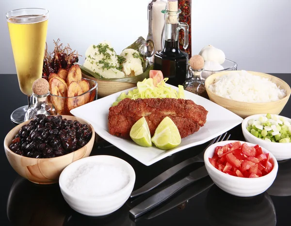 Breaded fish with staple caribbean sides — Stock Photo, Image