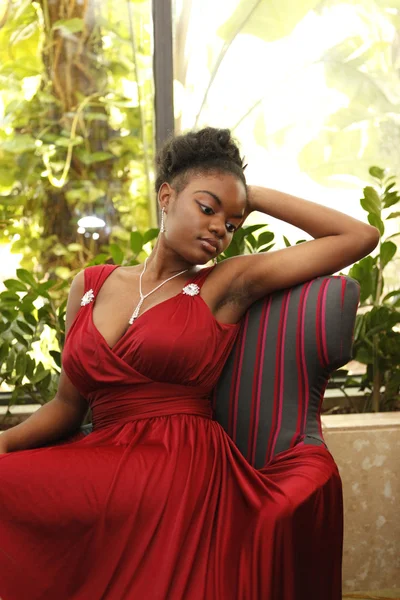 African american girl in a burgundy gown — Stock Photo, Image