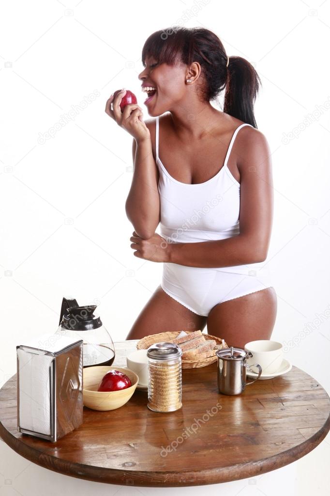 Girl eat an apple for breakfast
