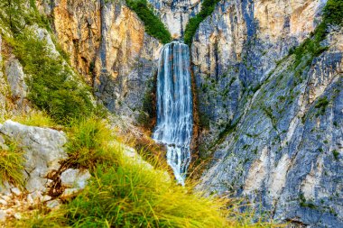 Big waterfall in the mountains. Slovenia Landscape. clipart