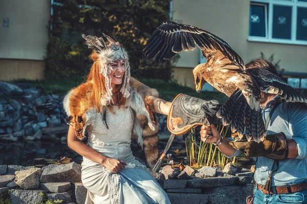 Beautiful shamanic woman with eagle in the nature. — Stock Photo, Image