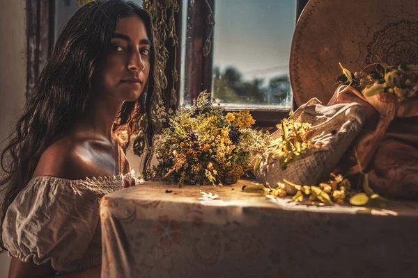 Exotic woman with shamanic drum and the herbs. — Stock Photo, Image