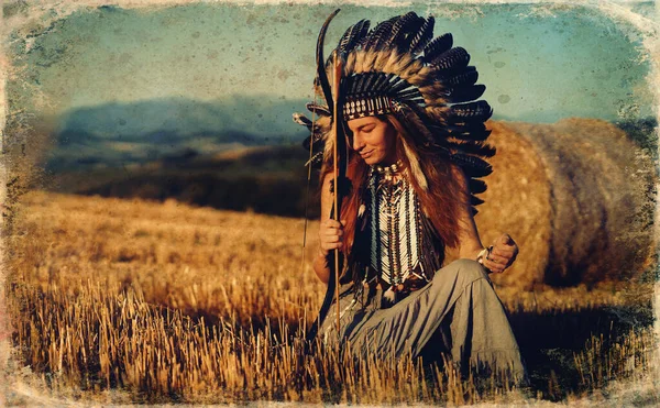 Beautiful shamanic girl in the nature with a bow. — Stock Photo, Image