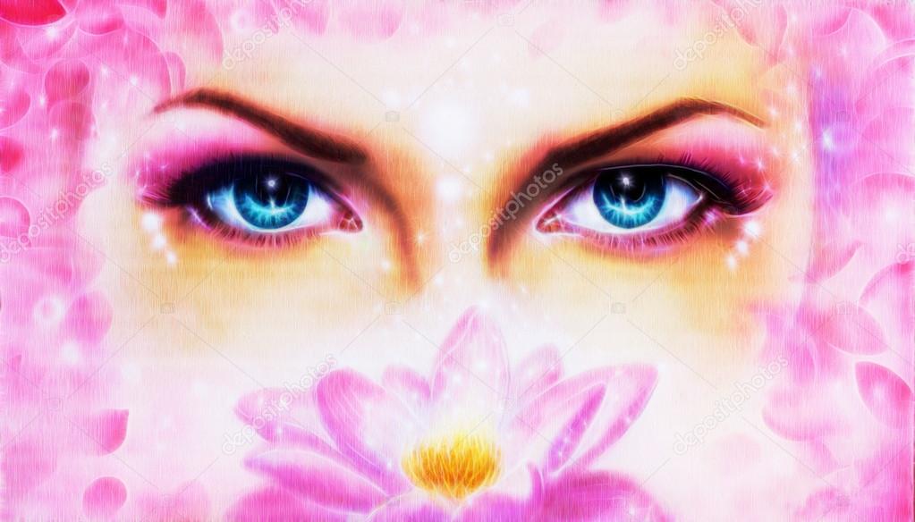 A pair of beautiful blue women eyes beaming  up enchanting from behind a bloming rosa lotus flower