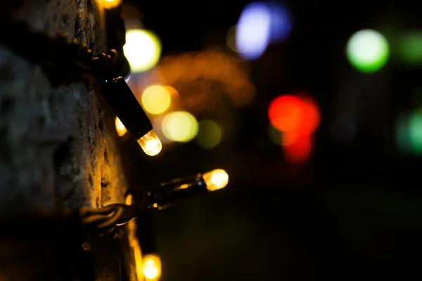 クリスマスの照明、クリスマスの背景。ボケ味を持つお祭りの抽象的な背景. — ストック写真