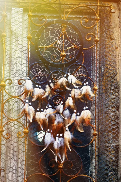 Dream Catcher and ornamental  window on background on Sun light . Rust structure on old window — Stock Photo, Image