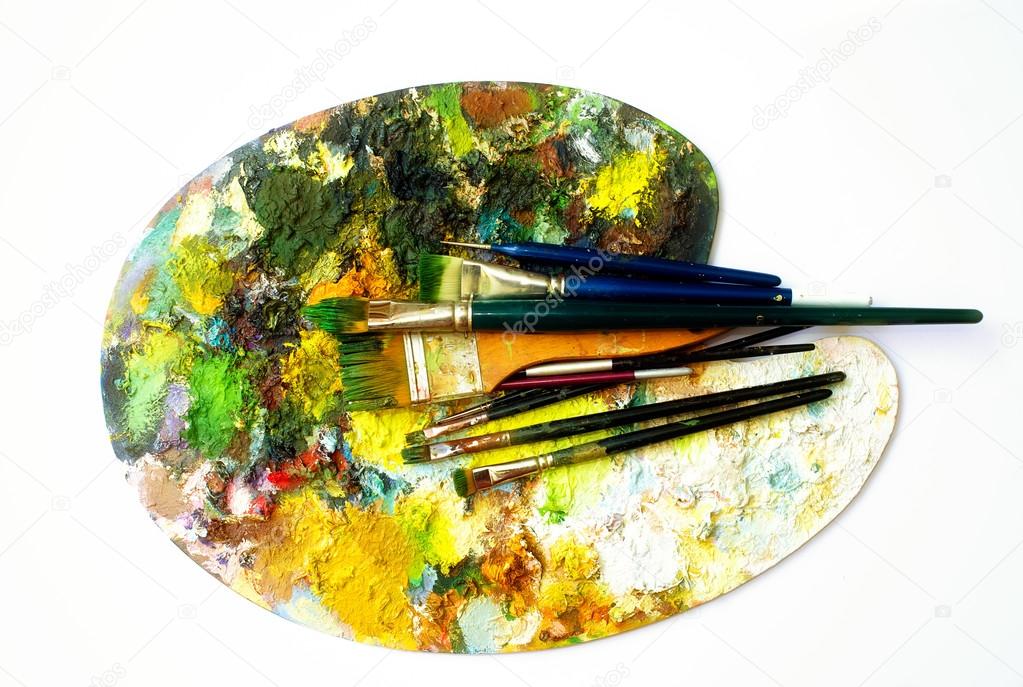 Paint brushes to the painting palette with colors on a white background
