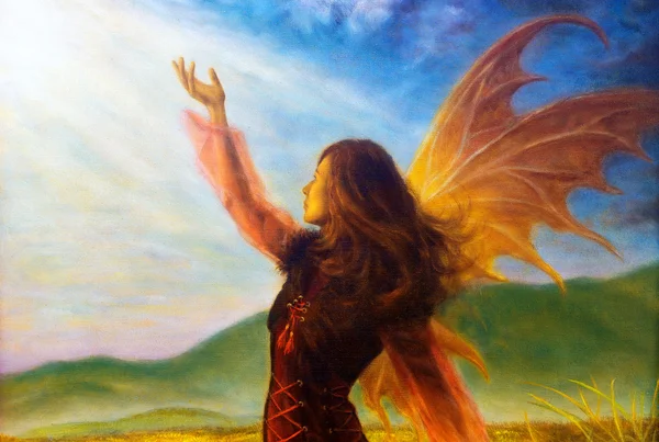 Painting fairy woman in a historic dress standing in rays of sunlight amids a wild meadow. — 스톡 사진