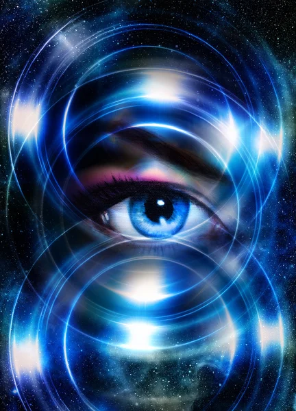 Woman eye and cosmic space, with light circle. blue color. — Stock Photo, Image