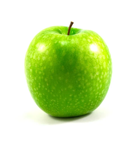 Una manzana verde sobre un fondo blanco —  Fotos de Stock