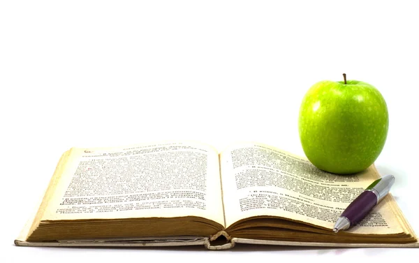Kniha s jablkem — Stock fotografie