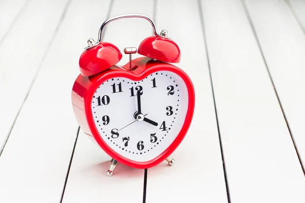 Red metal trolley and alarm clock — Stock Photo, Image