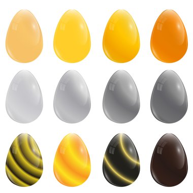 A set of twelve eggs. Gold, silver and chocolate color. The symb