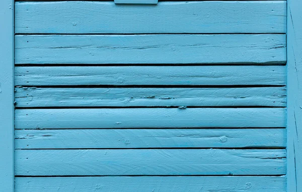 Blue painted wood planks or wall texture with nails and cracked wood, use as background or texture for game assets.