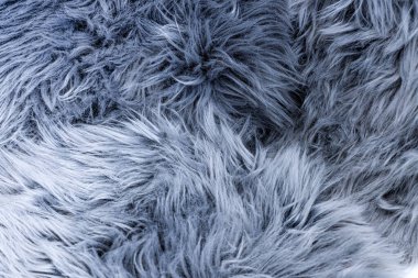 Nötr ışık durumundaki uzun tüylü kürkün üst görüntüsü, arka plan ya da duvar kağıdı olarak kullanın, bu plastik kürk.