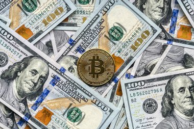 100 dolarlık banknotlarda altın Bitcoin.