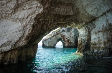 Beautiful blue caves on seashore in Zakinthos clipart
