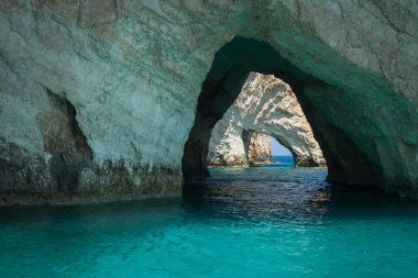 Beautiful blue caves on seashore in Zakinthos clipart