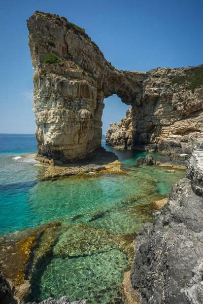 Unique and scenic arch in cliffs, Paxi — Stock Photo, Image