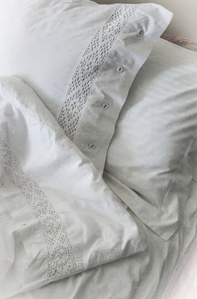 White embroidered linens, pillows and blanket — Stock Photo, Image