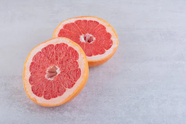fresh ripe red grapefruits on table