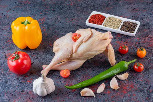 raw chicken meat with ingredients for cooking