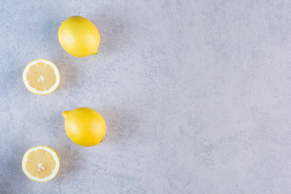 fresh yellow lemons on a grey background  