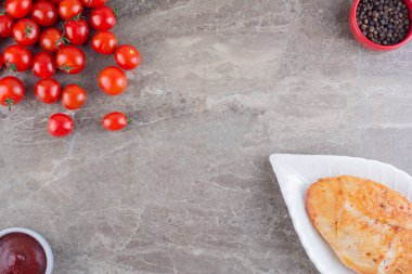 fried chicken breast with tomatoes. top view. copy space.