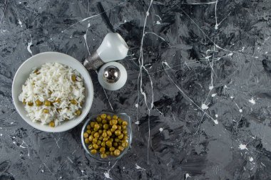 delicious dish with rice on grey kitchen table