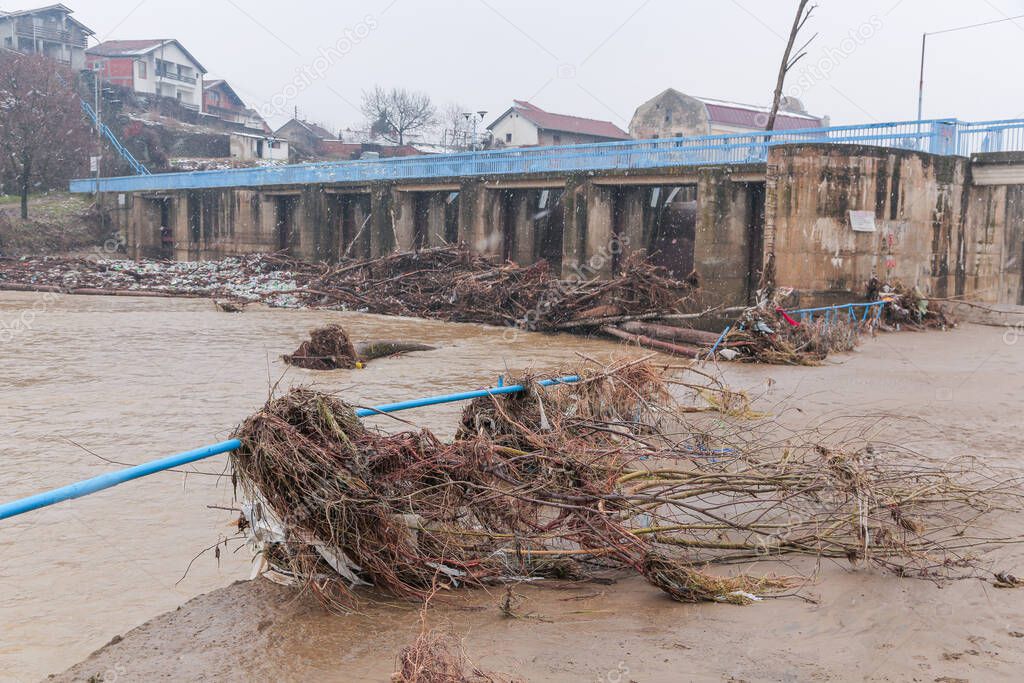 River after flood with plastic and wood pollution . Vlasina river, Serbia. Ecology problem.