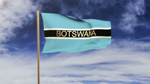 Η σημαία της Μποτσουάνα με τίτλο που χαιρετάει τον άνεμο. Ο ήλιος ανατέλλει. Βρόχος κίνησης — Αρχείο Βίντεο