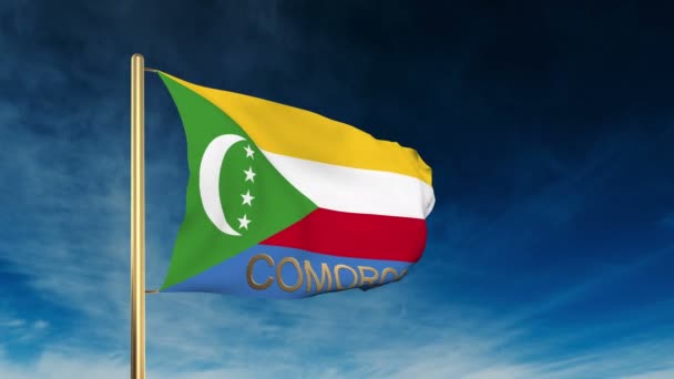 Comoros flag slider style with title. Waving in the wind with cloud background animation — Stock Video