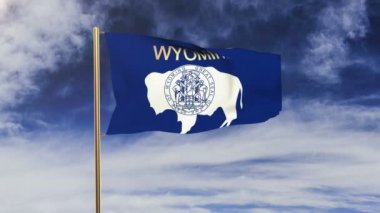 wyoming flag with title waving in the wind. Looping sun rises style.  Animation loop