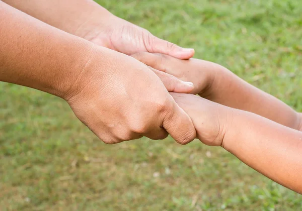 Father holds the hands of a small child — Stock Photo, Image