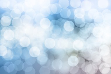 Mavi arkaplanda bulanık ışıklar ya da mavi arkaplanda ışıklar.