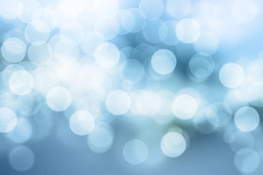 Mavi arkaplanda bulanık ışıklar ya da mavi arkaplanda ışıklar.