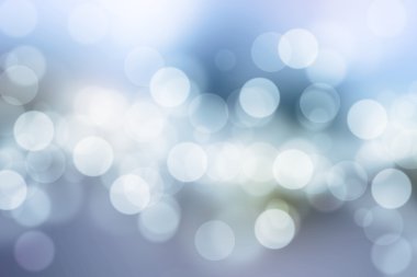 Mavi arkaplanda bulanık ışıklar ya da mavi arkaplanda ışıklar.