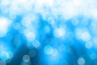 Mavi arkaplanda bulanık ışıklar ya da mavi arkaplanda ışıklar.