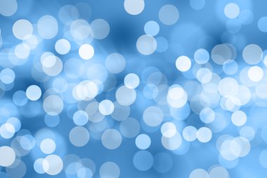 Mavi arkaplanda bulanık ışıklar ya da mavi arkaplanda ışıklar.